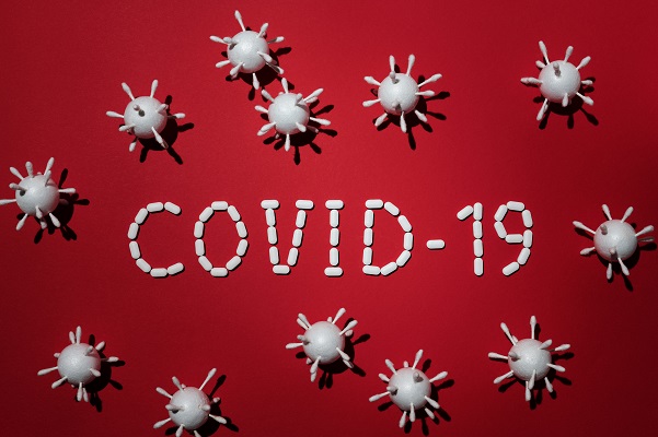 Schaubild COVID-19 mit rotem Hintergrund.